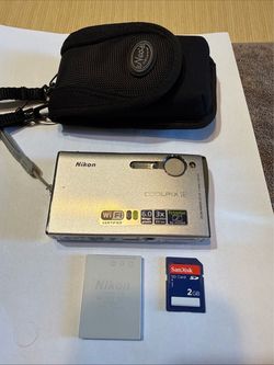 Silver Nikon Coolpix S6 digital camera has a 6.0 megapixel sensor and a 3x Zoom-Nikkor ED lens. This compact camera includes built-in WiFi capabilitie