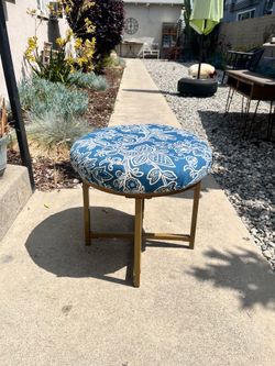 Ottoman with vintage upholstery newly applied