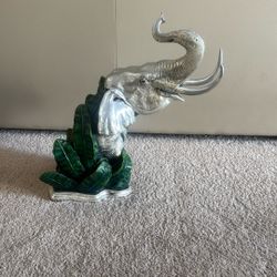 Elephant Sculpture With A Polished Metallic Upper Body And A Detailed Painted Jungle Scene