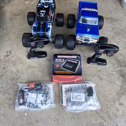 TRAXXAS "BIG FOOT" & "STAMPEDE" 2wd RC TRUCKS, W/ CHARGERS, BATTERIES, REMOTES. ( less than 1hr. of use)...asking $450.00 **FOR BOTH**