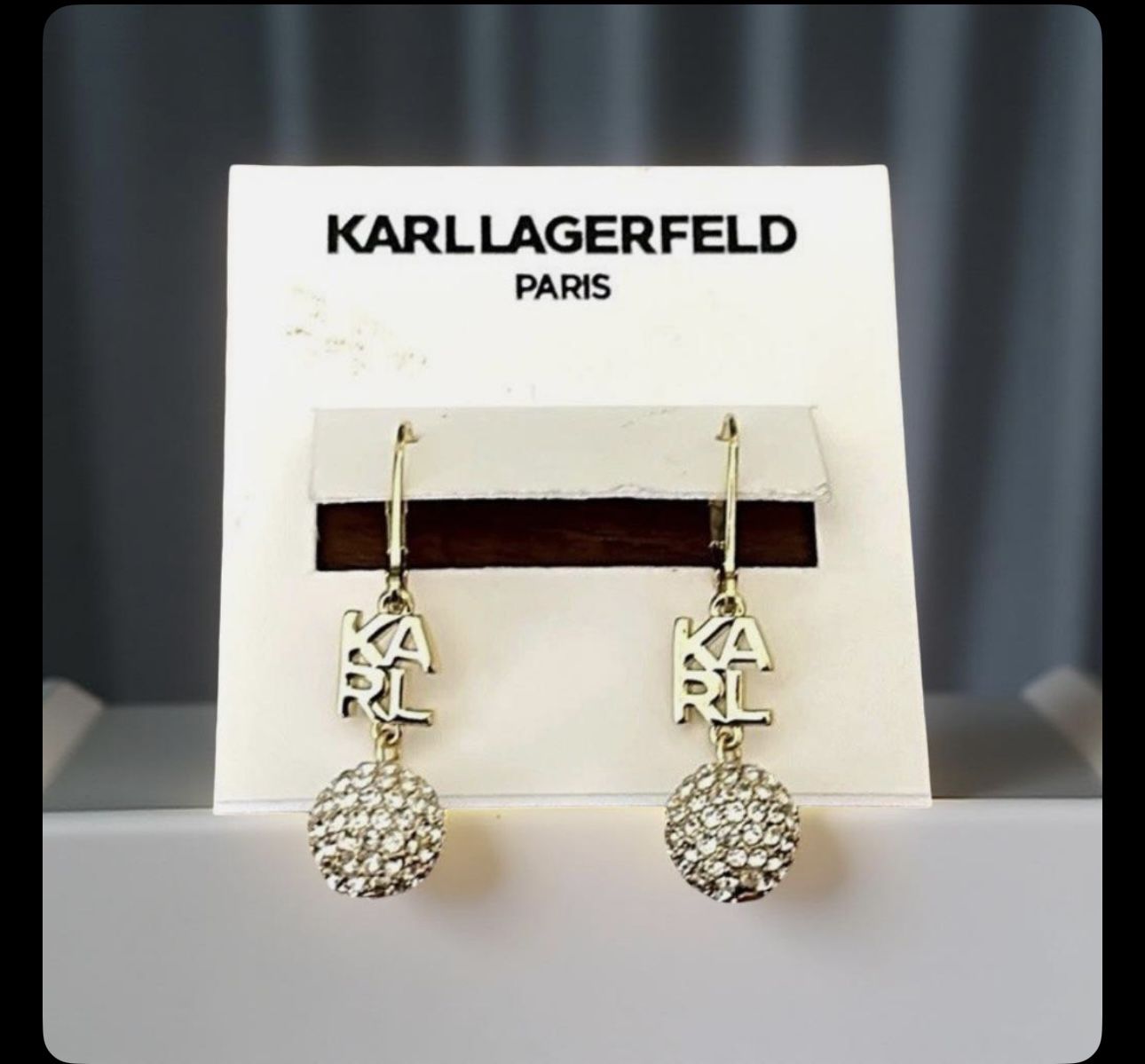 Karl Lagerfeld Paris drop earrings featuring the brand's logo and a crystal pavé ball.