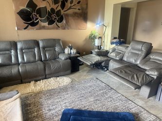 Sofa - Grey leather, dual power recliner with adjustable lumber