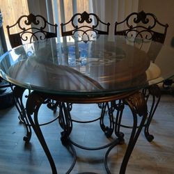 Glass Table w/ 3 Spinning Chairs 