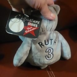 Babe Ruth baseball-themed beanie bear, likely from a "Salvino's Bamm Beanos" or similar collection. 
It's a collectible plush toy featuring a baseball