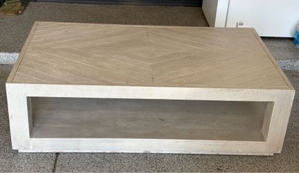 Large solid wood herringbone coffee table. driftwood finish and an open lower shelf. 35x60 inches