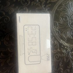 Alarm clock that shines time on ceiling. 