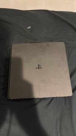 PS4 with controllers and a stand