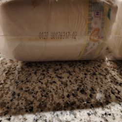 Two Packages Of Diapers For Newborns