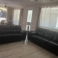 2 Leather Three-seat Couch By Ashley