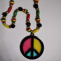 Reggae style wood beads and resin peace sign