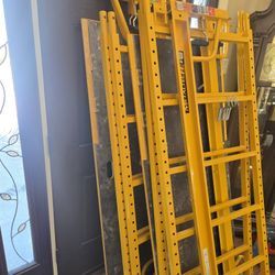 Two Set Of Scaffolds With Wheels And Pins And Adjustable Platforms