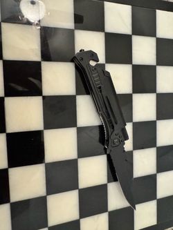 Muti purpose folding knife with flint stick