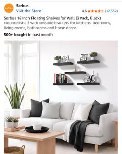 Set of three black floating wall shelves, 16 inches each.
