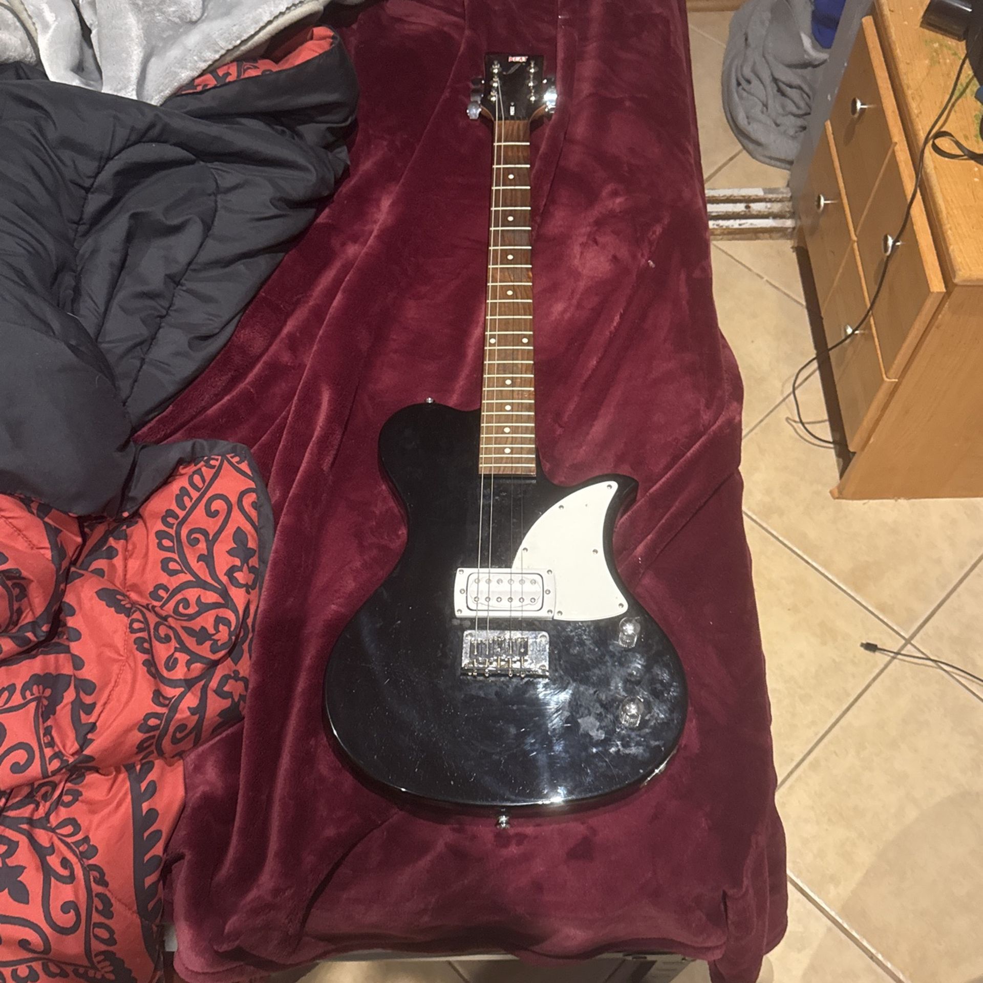 first act black electric guitar