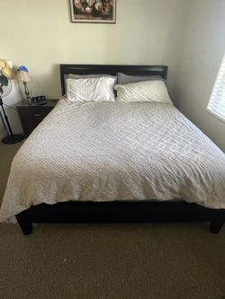 Cal king bed with mattress, box spring, and 2 night stands