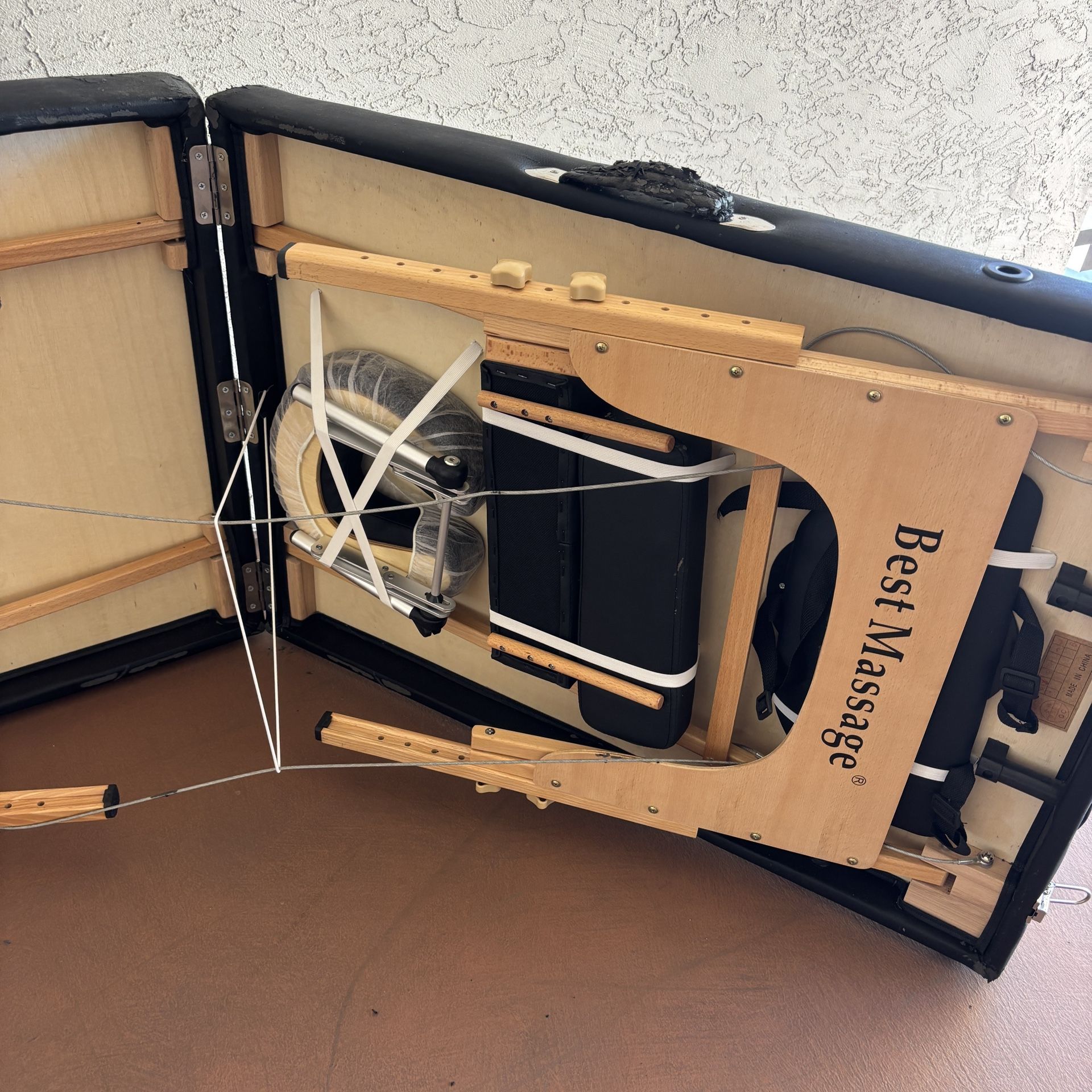 One Black Massage Table With accessories and Black Carrying Case