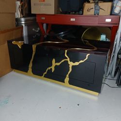 ** BLACK AND GOLD COFFEE TABLE WITH STORAGE 