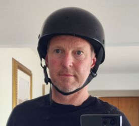 Black Harley-Davidson DOT-certified half helmet. Size Large