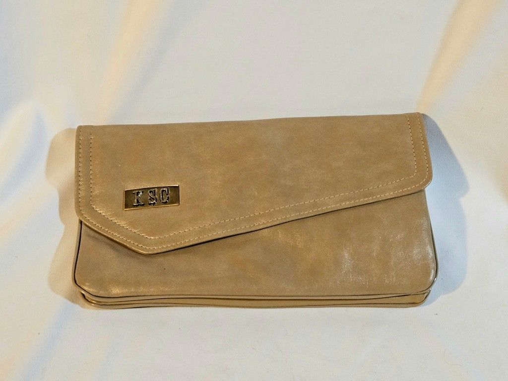 KSC Foldover Clutch Woman's Brown Excellent Vintage Condition The KSC Foldover Clutch is a stylish and versatile accessory for women, perfect for casu