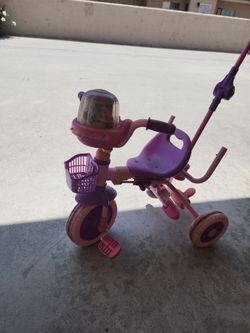 Pink and purple pushing bike