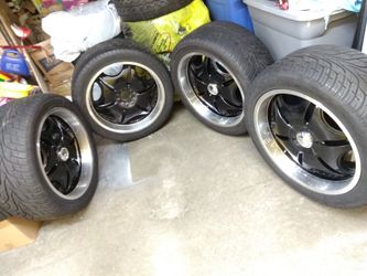 22 inch black on chrome Rims with 84% tread tires 5lug