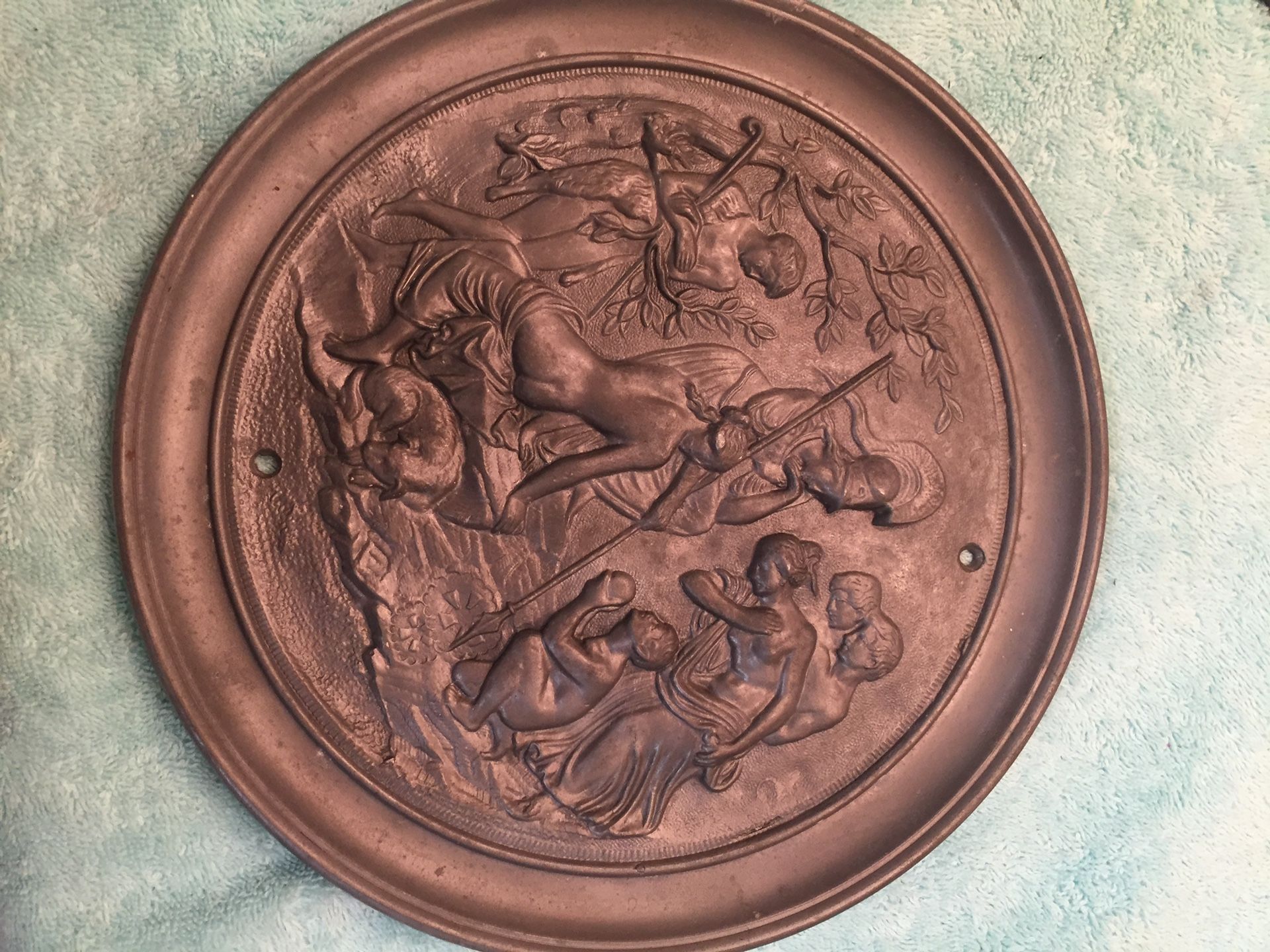 Super old heavy metal plates that have Roman carvings and other pictures check it out not sure what it was for