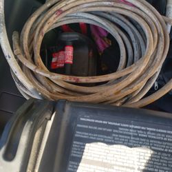 Air Compressor And Nail Gun Hoses And Also Two Drill Bits For Industrial Drills