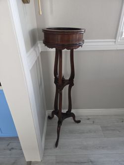 Plant stand. Solid wood mahogany like very tall tower antique vibe