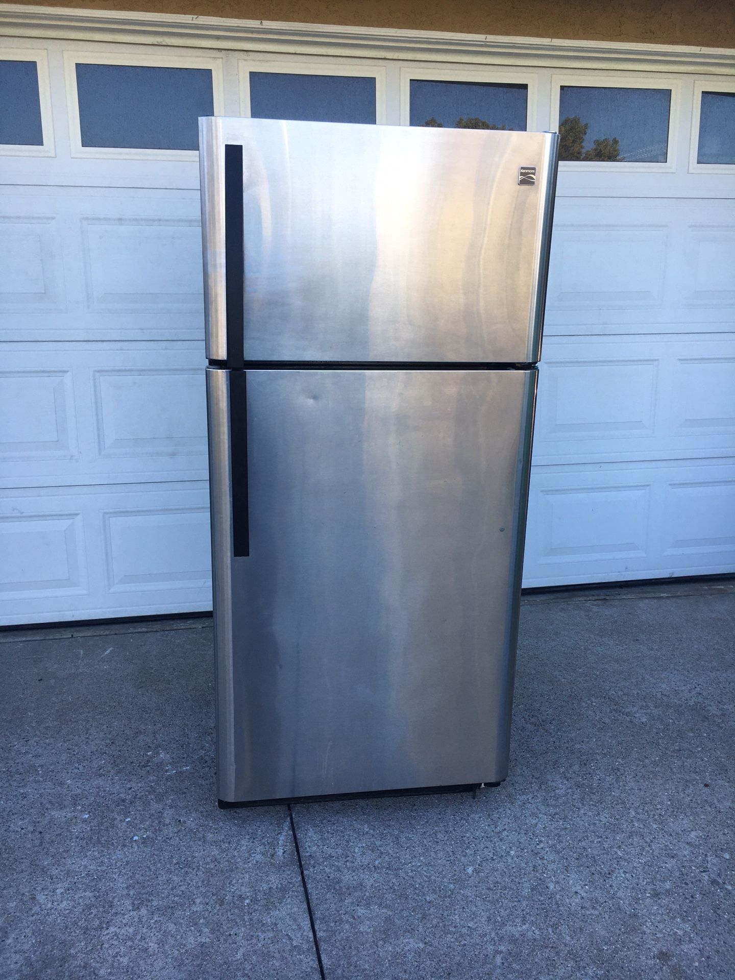 Stainless steel kenmore refrigerator w/ ice maker works excellent