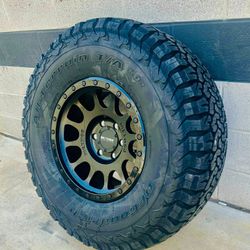 New Method 17x8.5 Black On Black Wheels & 35x12.50-17 BF Goodrich Ko2 A/T Tires For Truck & Suv 5 6 8 LUG  (We Finance 