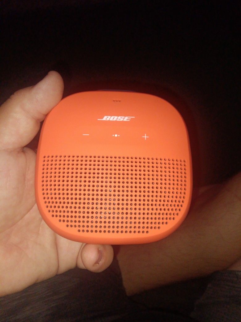 Orange Hand Held Bose Speaker