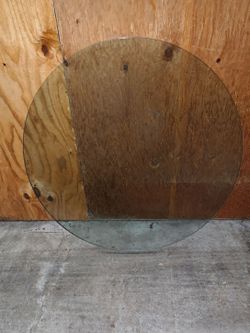 48-inch round thick glass tabletop in excellent condition.