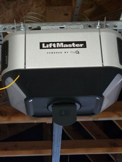 LiftMaster garage door opener with myQ smart technology, still mounted to its rail system in a garag