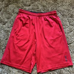 Red Reebok basketball shorts; excellent condition