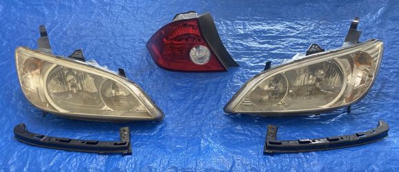 Honda Civic headlights and one tail lamp