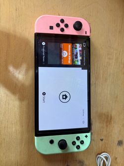 Nintendo Switch with Pink and Green Joy-Cons