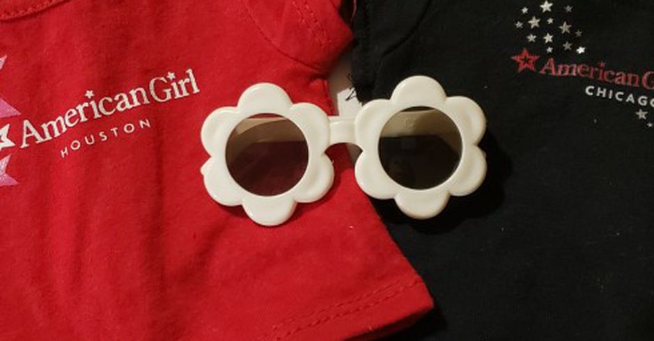 Two AG Tshirts, 1 Book, Sunglasses For Dolls