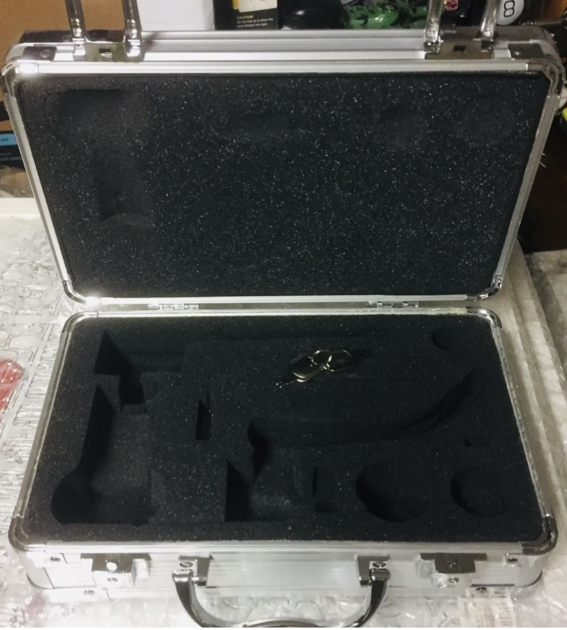 Note: Case only-in stock. Each case has a different engraved serial number. Brand new beautiful aluminum locking camera or gun case. Comes with 2 keys