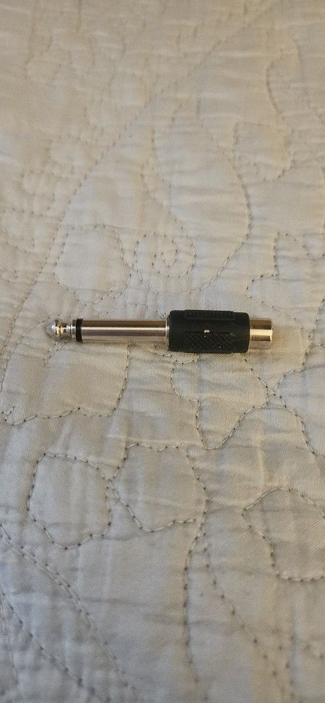 RCA female to 1/4" male audio adapter.