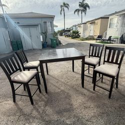 Dining Table + 4 Chairs – $150