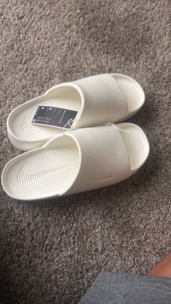 White Nike calm slides