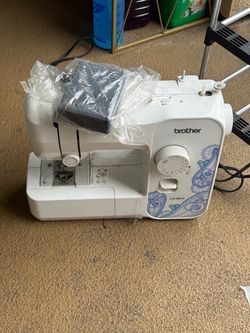 Brother LX3817 Sewing Machine – 17 Stitch Includes foot pedal and accessories shown.