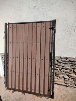 Metal Brouwn Door Gate.  Solid Wood Panel.  Incluye  Post     Good Condition.   ,,   Size 48"Inches Wide.  70"Inches Tall.  $.  290. 