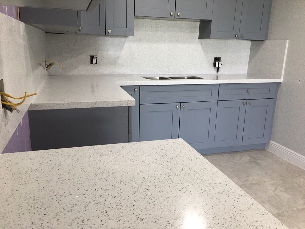 Gray cabinets, quartz sparkling white full back splash