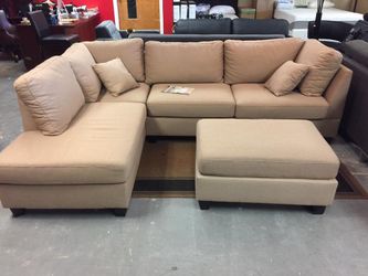 Brand new reversible sectional sofa with free ottoman
