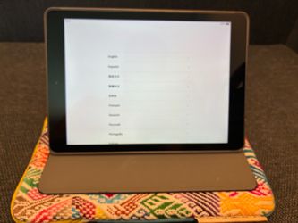 Apple iPad A1474 air with Logitech protective case and artisanal protective pouch