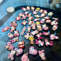 54 Hello kitty croc charms all for $10