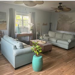 One Green couch and loveseat