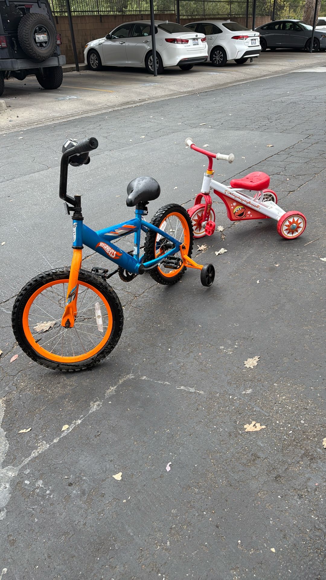 Hot Wheels bike and Elmo Tricycle