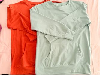 Two Women’s Sweatshirts size Medium